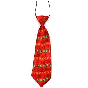 Macro detail of red Christmas tree pattern dog tie with black elastic neck strap