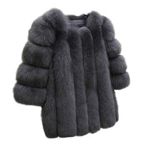 Detailed view of dark grey faux fur coat featuring a thick horizontal paneled design