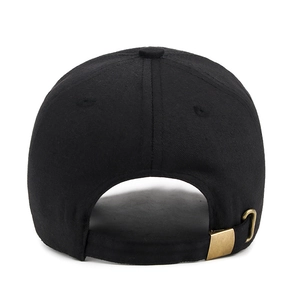 Adjustable black cotton baseball cap showing back view with bronze metal buckle closure