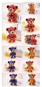 Detailed views of sparkly teddy bear keychains with rhinestones in red, blue and gold