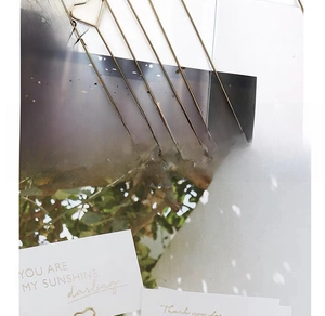 Detail of gold metal flower picks with heart shapes for floral arrangements and cards