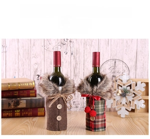 Detail of Christmas wine bottle covers featuring plaid fabric and faux fur collars