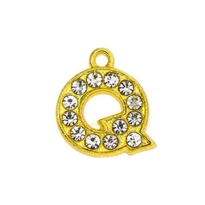 Detail of a 15mm gold-plated letter Q pendant encrusted with sparkling white rhinestones