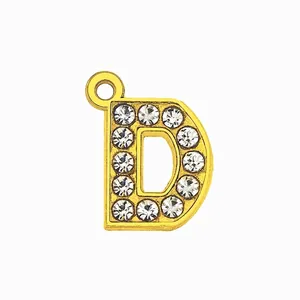 Detail of a 15mm gold-plated letter D pendant with sparkling crystal inlay for DIY jewelry