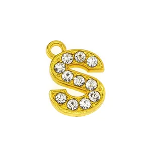 Detailed close-up of a 15mm gold S-letter pendant with sparkling pavé cubic zirconia
