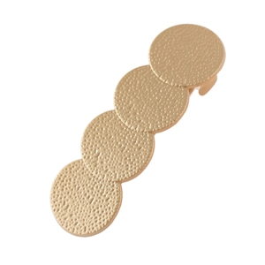 Barrette à cheveux dorée mate avec quatre cercles superposés pour un style géométrique