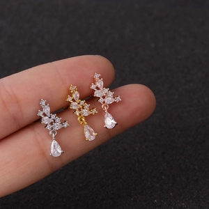 Exaggerated crown-shaped drop earrings with cubic zirconia in silver, gold, and rose gold