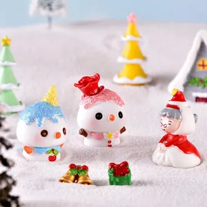 Miniature resin Christmas figurines featuring snowman and Santa Claus for holiday decor