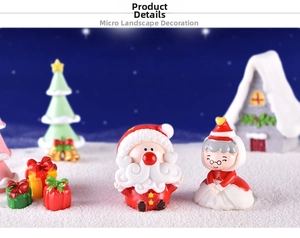 Miniature resin Santa Claus and Mrs. Claus figurines in a cozy winter snow scene