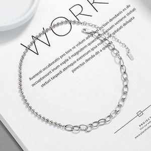 Detail of 925 sterling silver necklace showing ball and cable chain link combination