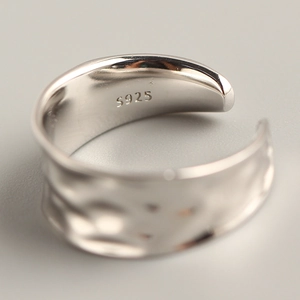 Minimalist S925 sterling silver wide ring featuring an irregular concave hammered texture