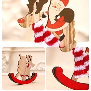 Close-up of wooden rocking horse ornament with Santa riding a reindeer and red base