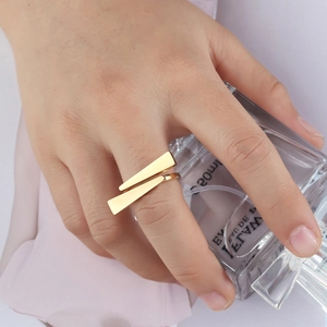 Modern gold geometric stainless steel wrap ring with unique parallel tapered design
