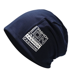 Navy blue cotton slouchy beanie for women featuring a white fashion logo print