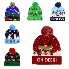 Detail of Christmas knit beanies with festive patterns like deer and pom-pom tops