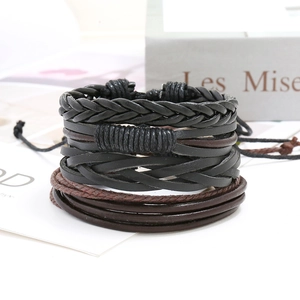 Detail of multi-layer woven leather bracelets in black and brown with adjustable cords