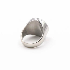 Macro view of polished silver stainless steel ring band showing inner metal texture