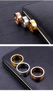Detailed view of brushed stainless steel rings in gold, silver, and rose gold finishes