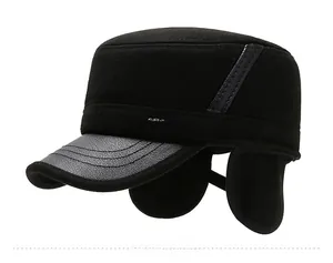 Detail view of winter ear protection flat cap for men with Sport metal tag and leather brim