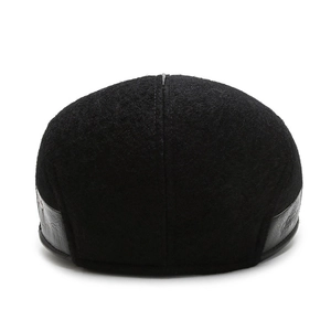 Winter wool newsboy cap in black with leather trim detail, stylish rear view