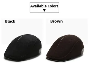 Detail of wool flat caps in black and brown with vintage leather brim and metal rivets