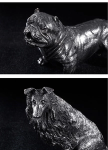 Macro shot of vintage stainless steel bulldog and sheepdog metal craft ornaments