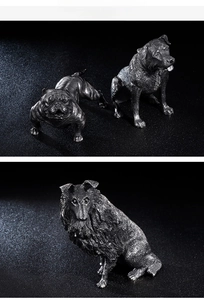 Macro detail showing vintage dog statues with realistic fur texture and metallic finish