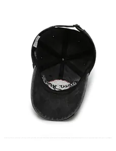 Detailed interior of vintage washed black cotton baseball cap with reinforced seams
