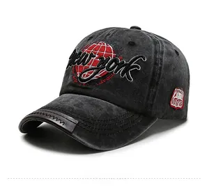Detail of vintage washed baseball cap with New York embroidery and leather brim accent