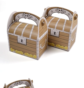 Detail of a pink pirate treasure chest gift box with cartoon skull and gold coin prints