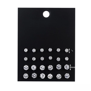 Detail view of 12 pairs of zircon stud earrings with 4mm and 6mm sizes on display card