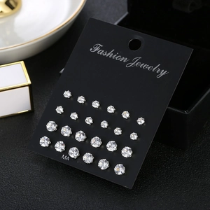 Detail of 12 pairs cubic zirconia stud earring set on a premium black display card