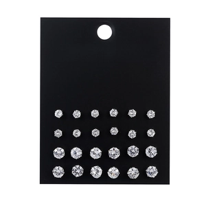 Set of 24 pairs of silver cubic zirconia stud earrings in varying sizes on black card