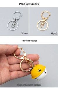 Detailed view of silver and gold metal D-ring swivel clasps with decorative bell charms