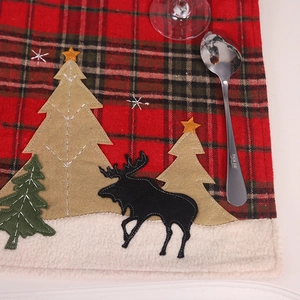 Christmas plaid placemat with reindeer embroidery and snow texture for festive dining