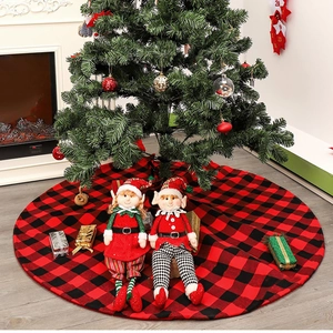 Classic red and black plaid fabric Christmas tree skirt with festive elf doll decorations