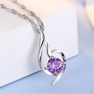 Elegant angel pendant necklace with a round purple zircon in a silver-tone setting