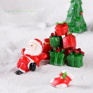 Miniature Christmas resin figurine set with Santa Claus and gift boxes for tabletop decor