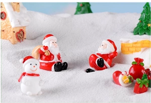 Detailed view of Christmas miniatures featuring Santa and snowman in a snowy scene