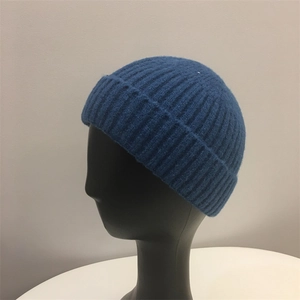 Close-up of deep blue ribbed knit beanie with wide cuff on a display model