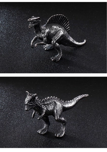 Detailed view of Spinosaurus and Carnotaurus metal models with fine scale textures