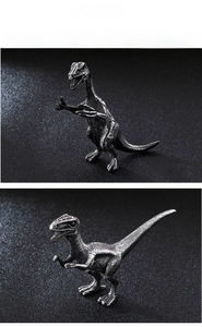Detailed close-up of a stainless steel dinosaur sculpture with realistic scale texture