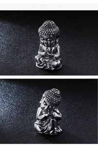 Macro shot of miniature stainless steel Buddha figurines in prayer and meditation poses