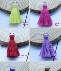 Detail view of 3.5cm cotton fringe tassels with metal rings in four vibrant colors