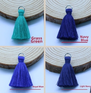 Detail of 3.5cm cotton tassels in grass green, navy and royal blue with silver rings