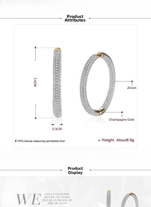 Detailed view of champagne gold hoop earrings with zircon pavé measuring 3.4cm in height