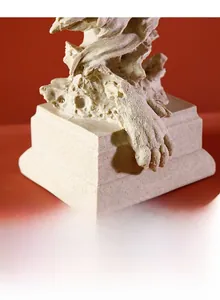 Macro detail of the matte stone texture and tiered base of this lion head resin sculpture