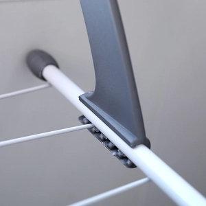 Multi-functional folding balcony drying rack with grey plastic joints and white metal tubes