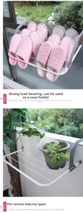 Close-up of white iron balcony drying rack used as a plant stand and shoe holder