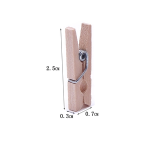 Detail showing 2.5cm natural wood photo clip dimensions with structural metal spring